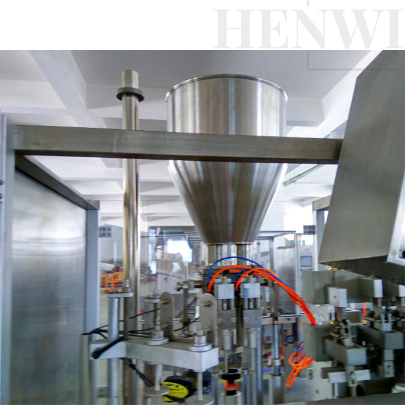 Automatic high speed tube filling and sealing machine