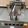 Semi-automatic film overwrapping and sealing machine