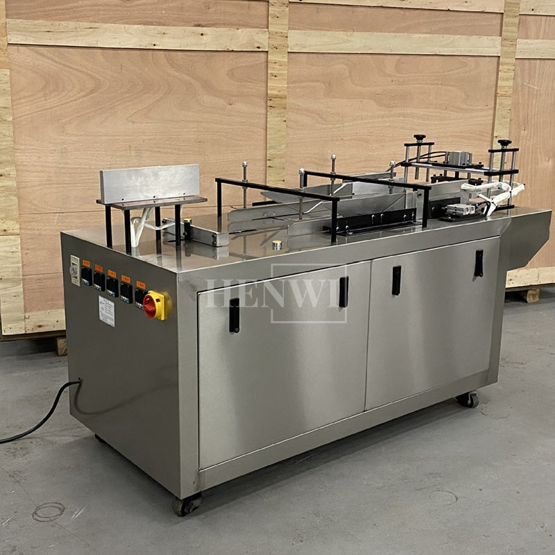 Semi-automatic film overwrapping and sealing machine