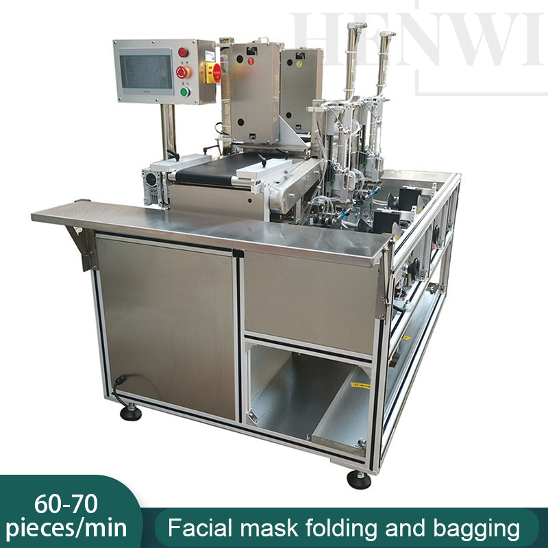 Facial mask folding and bagging machine