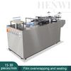 Semi-automatic film overwrapping and sealing machine